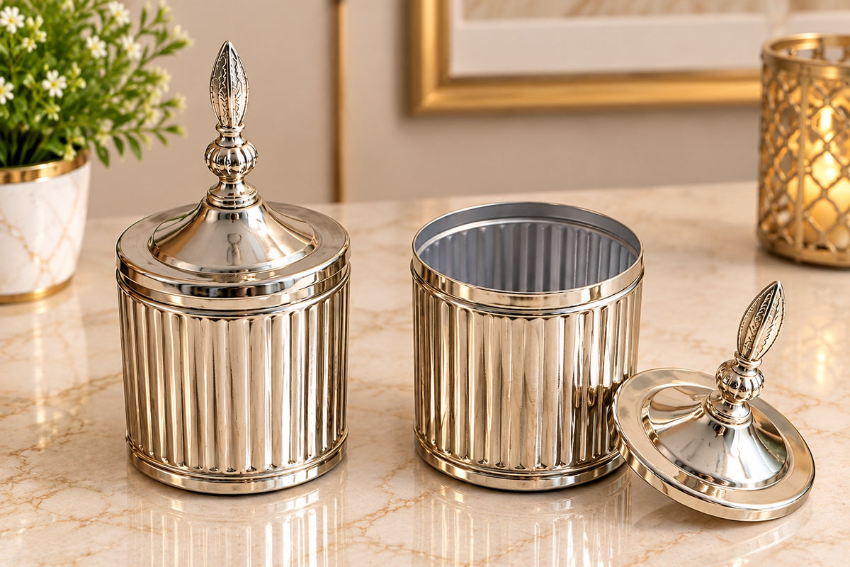 Maverics silver and golden ribbed storage jar with ornate finial lid, 4 x 4 inches