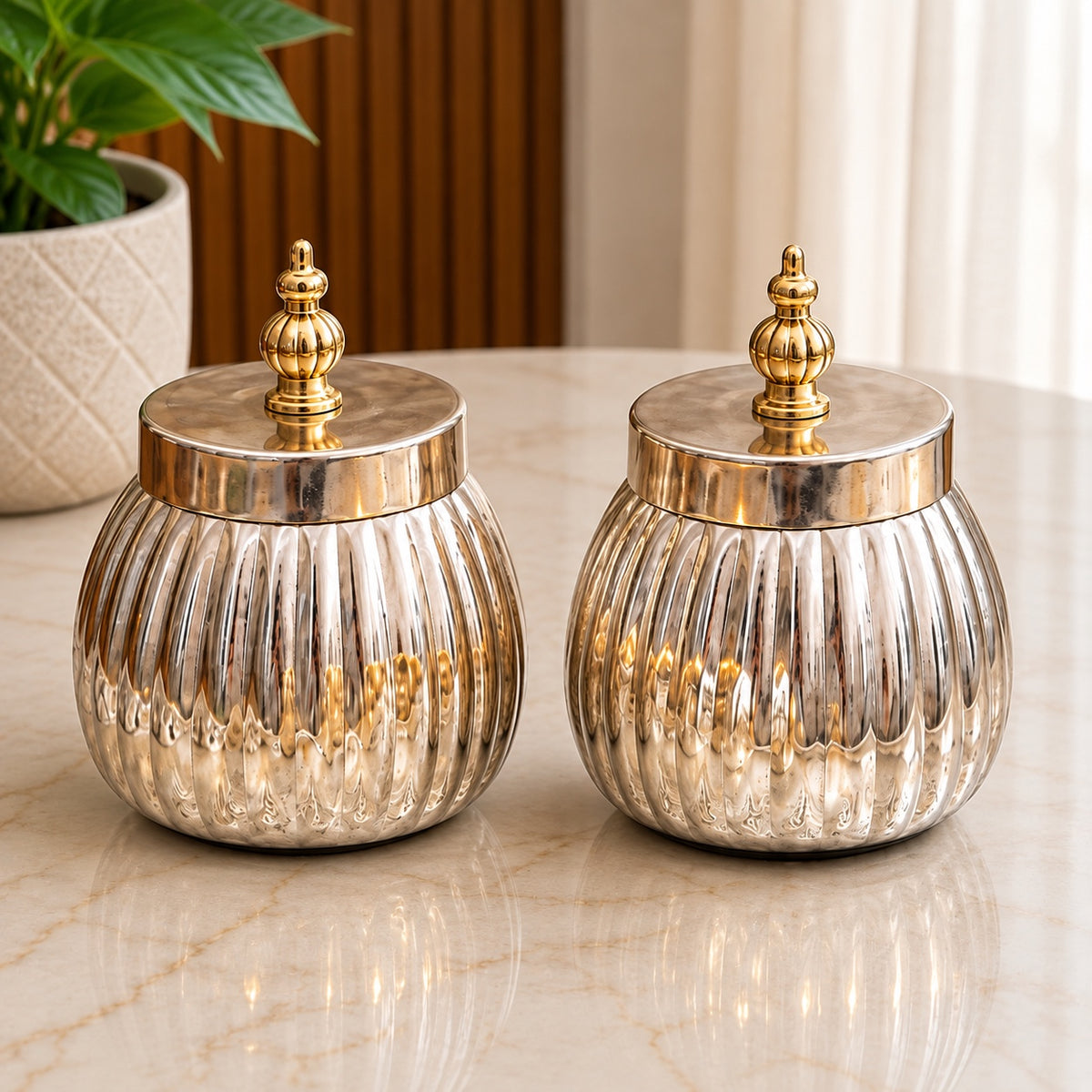 Maverics silver and golden ribbed decorative storage jars with ornate finial lids, 3.5 inches