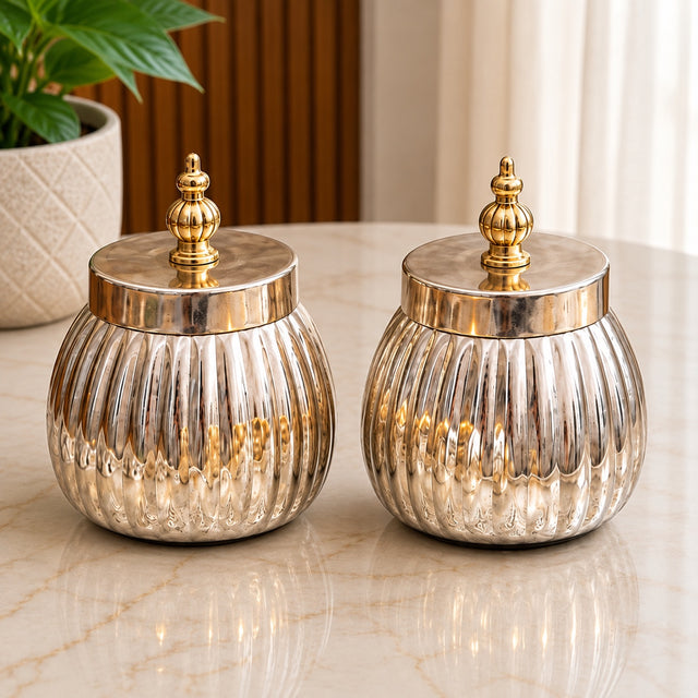 Maverics silver and golden ribbed decorative storage jars with ornate finial lids, 3.5 inches